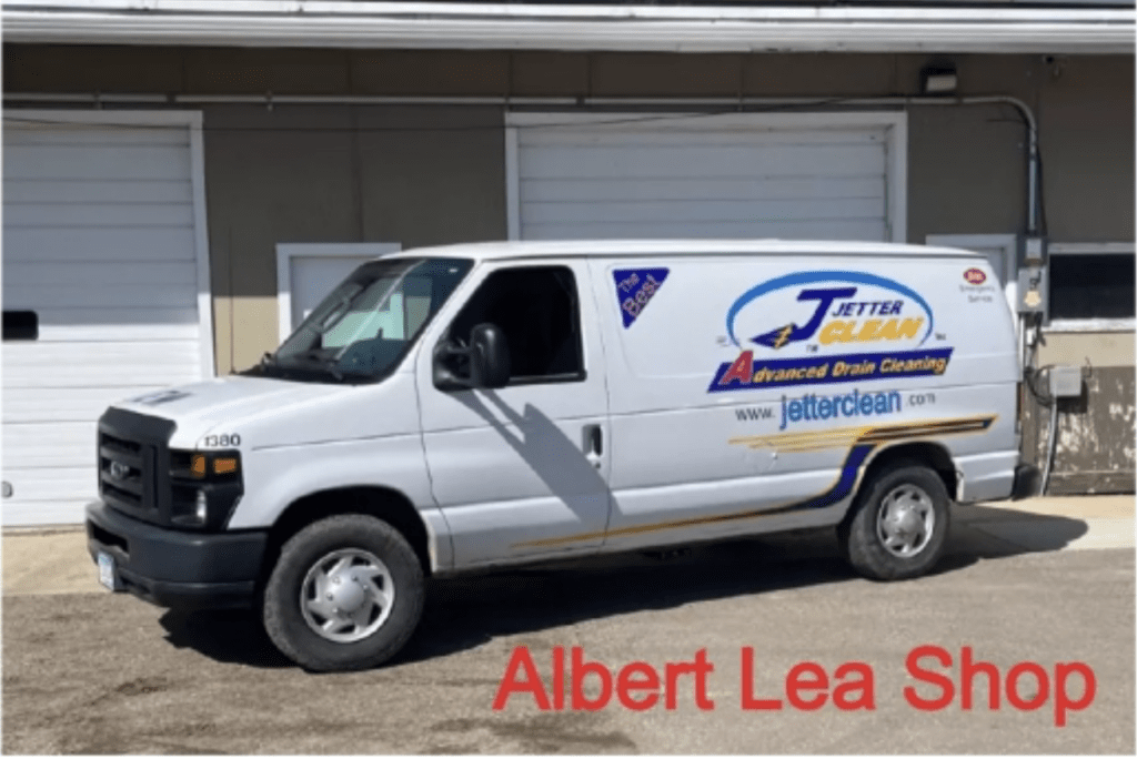 Jetter Clean van in front of the Albert Lea garage doors